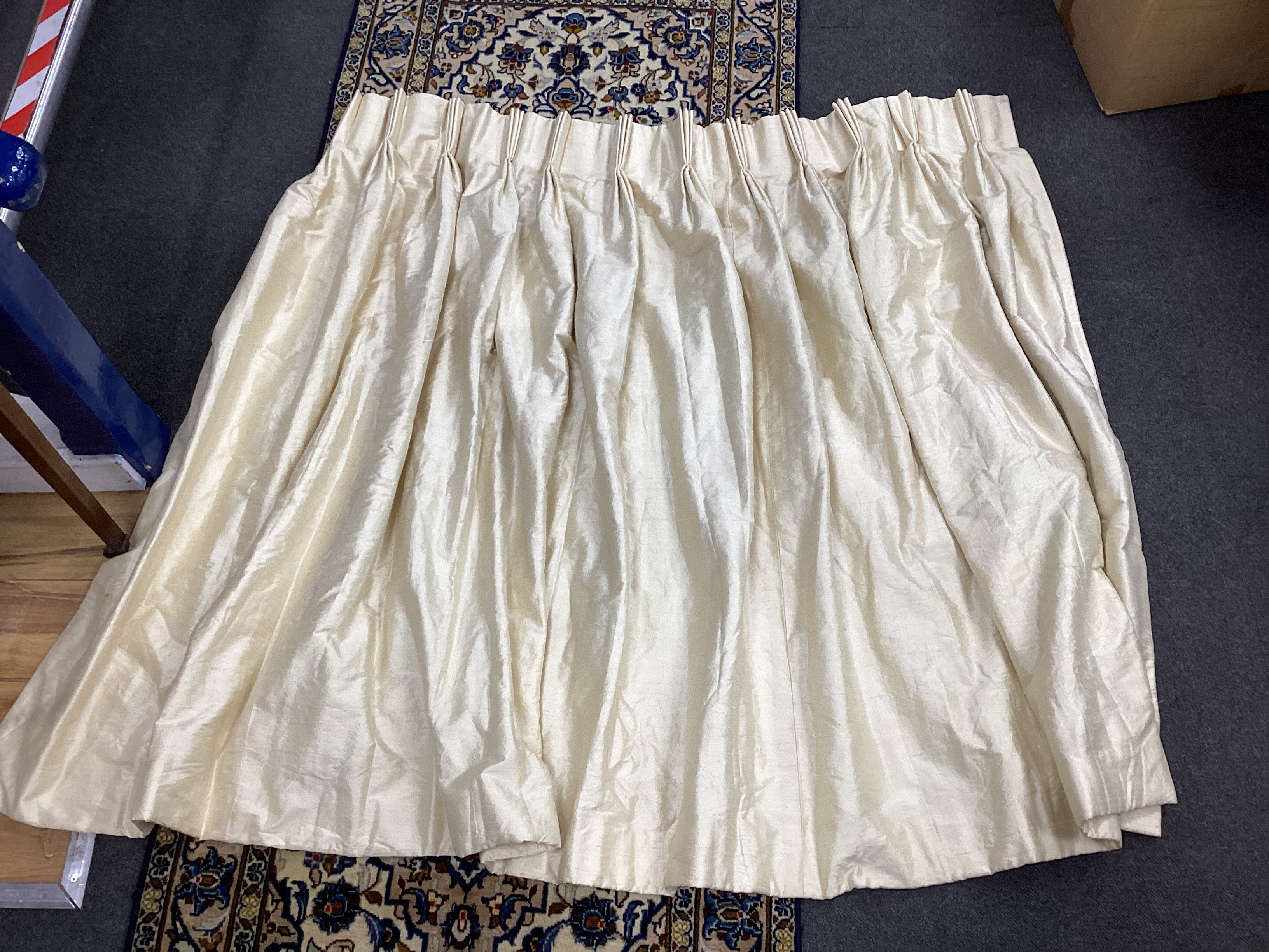 A pair of ivory coloured silk curtains, 137cm high